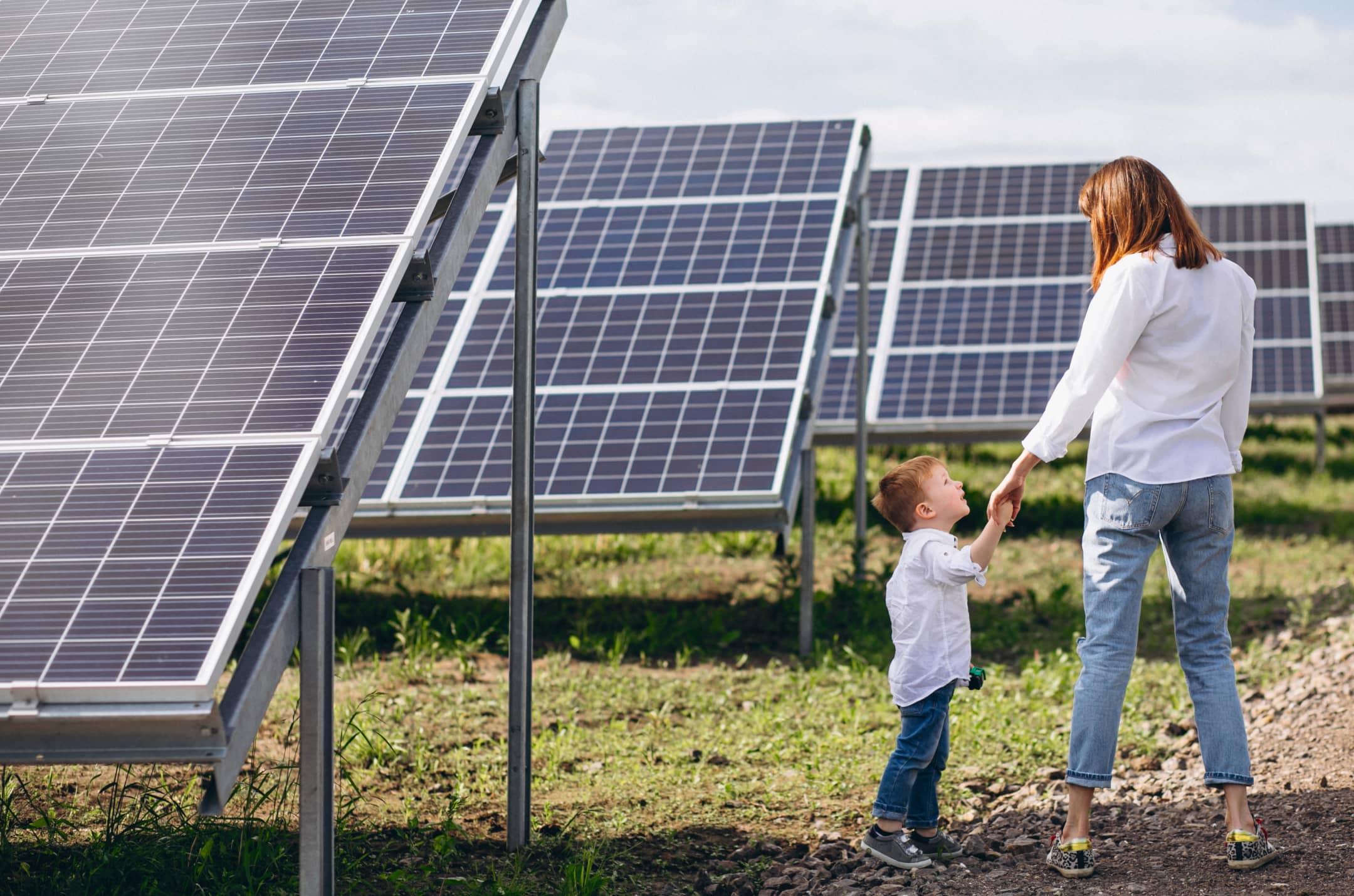 Solar panels under a bright sky